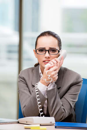 Call center operator working at her deskの写真素材