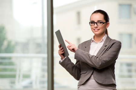 Young businesswoman working with tablet computerの写真素材