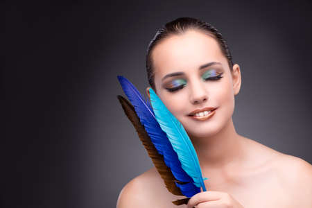 Beautiful woman with writing feather quillの写真素材