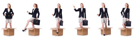 Businesswoman with boxes isolated on whiteの写真素材