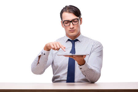 Handsome businessman working with tablet computer isolated on whiteの写真素材