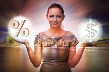 Businesswoman in high interest rates conceptの写真素材