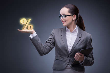 Businesswoman in high interest rates conceptの写真素材