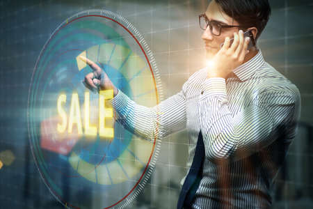 Businessman pressing buttons in sale conceptの写真素材