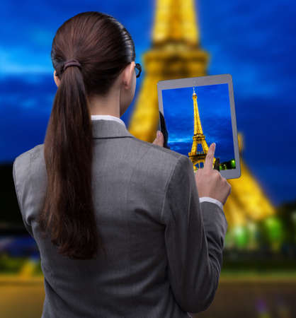 Virtual reality travel concept with woman and tabletの写真素材