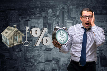 Young businessman surprised at high interest mortgage ratesの写真素材