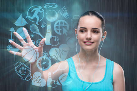 Young girl in sports concept pressing virtual buttonsの写真素材