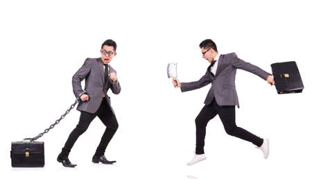 Businessman chained isolated on whiteの写真素材