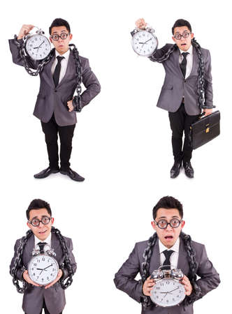 Businessman holding alarm clock isolated on whiteの写真素材