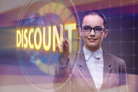 Businesswoman pressing buttons in sale conceptの写真素材