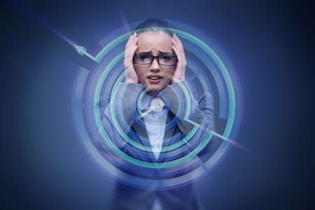 Sad businesswoman lost in mazeの写真素材