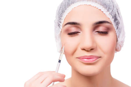 Young woman preparing for plastic surgery isolated on whiteの写真素材