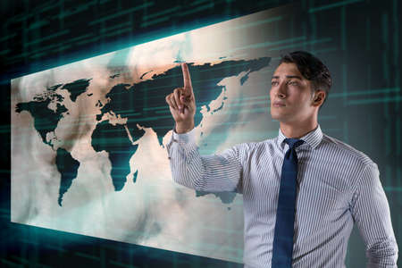 Businessman pressing virtual buttons in global business conceptの写真素材