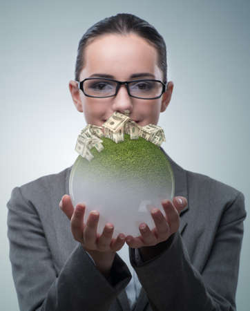 Businesswoman in housing mortgage conceptの写真素材