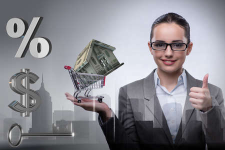 Businesswoman in real estate mortgage conceptの写真素材