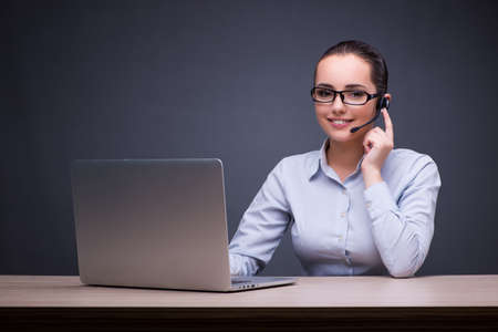 Businesswoman sitting at her desk in business concept