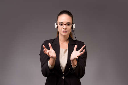 Young woman businesswoman pressing virtual buttonsの写真素材