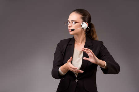 Young woman businesswoman pressing virtual buttonsの写真素材