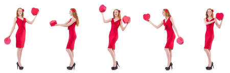 Red dress woman holding gift box isolated on whiteの写真素材