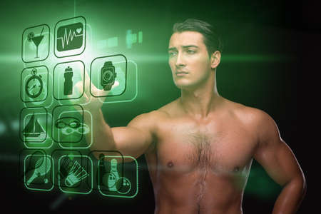 Young muscular man in sports conceptの写真素材