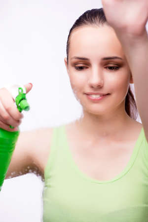 Young housewife in cleaning conceptの写真素材