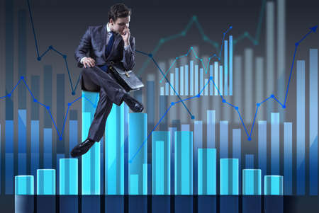 Depressed businessman in despair in crisis conceptの写真素材