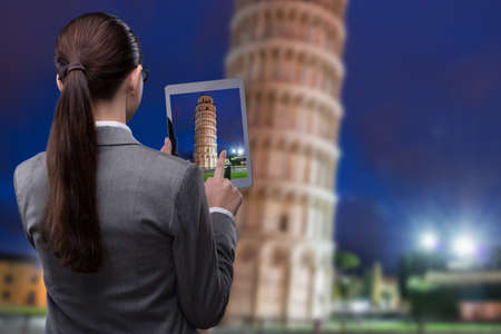 Virtual reality travel concept with woman and tabletの写真素材