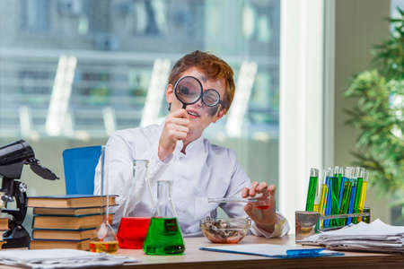 Young crazy chemist working in the labの写真素材