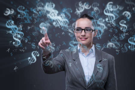 Businesswoman with dollars in business conceptの写真素材