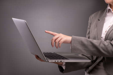 Young businesswoman working with laptop in business conceptの写真素材