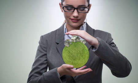 Businesswoman in housing mortgage conceptの写真素材