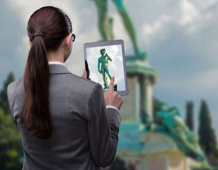 Virtual reality travel concept with woman and tablet