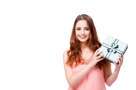 Young woman with giftbox isolated on whiteの写真素材