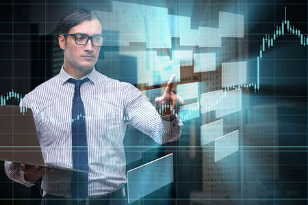 Young businessman in online trading conceptの写真素材