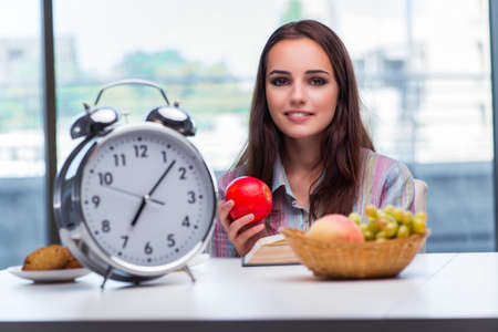 Young girl having breakfast on the morningの写真素材