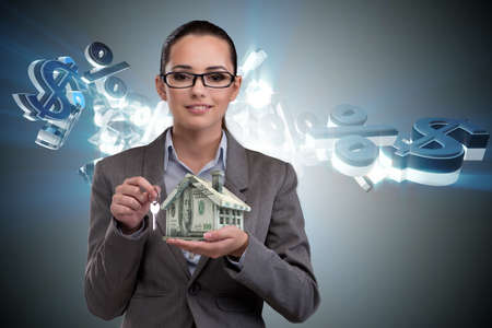 Businesswoman in real estate mortgage conceptの写真素材