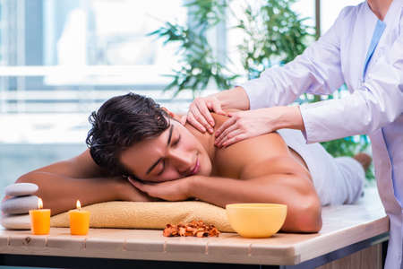 Man during massage session in spa salonの写真素材