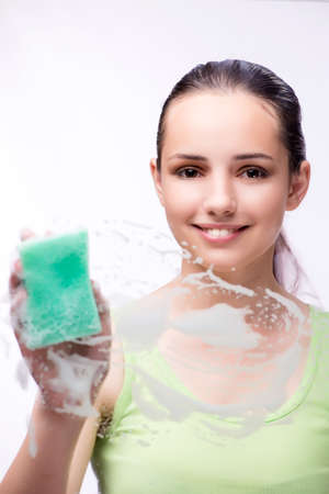 Young housewife in cleaning conceptの写真素材