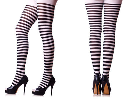 Legs with striped stockings isolated on whiteの写真素材