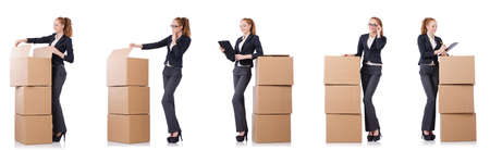 Businesswoman with boxes isolated on whiteの写真素材