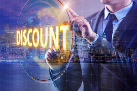 Young handsome businessman in sales conceptの写真素材