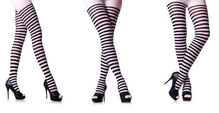 Legs with striped stockings isolated on whiteの写真素材