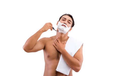 Handsome man shaving isolated on white backgroundの写真素材