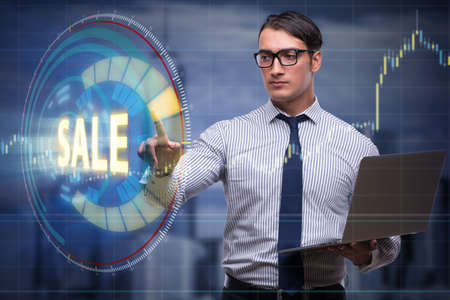 Businesswoman with laptop in sale conceptの写真素材