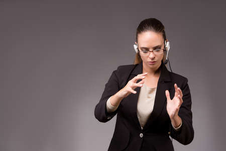 Young woman businesswoman pressing virtual buttonsの写真素材