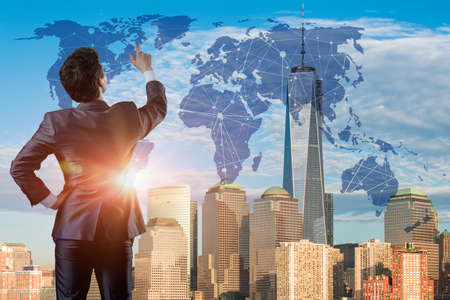 Businessman pressing buttons in futuristic conceptの写真素材