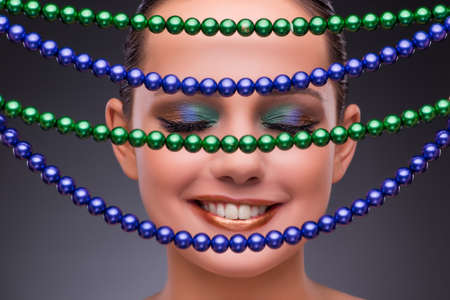 Beautiful woman with jewellery in beauty conceptの写真素材