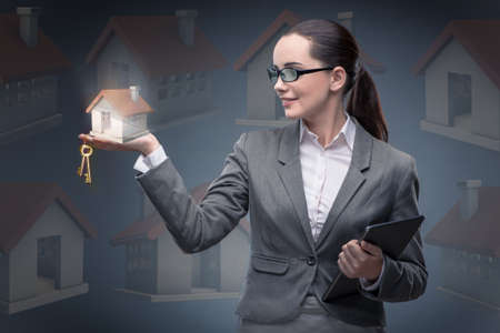 Businesswoman in housing mortgage conceptの写真素材