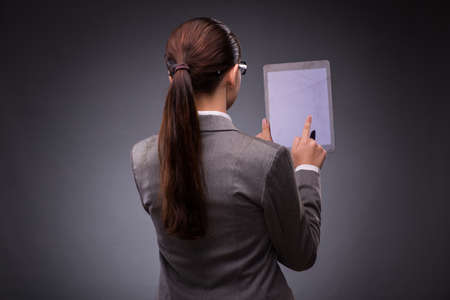 Woman with tablet computer in business concept