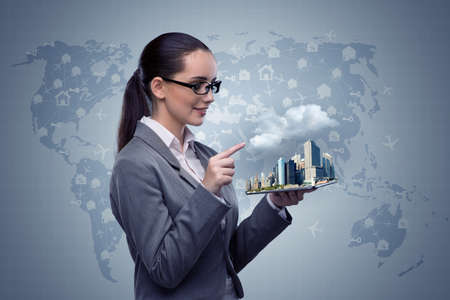 Businesswoman with tablet in hotel booking conceptの写真素材